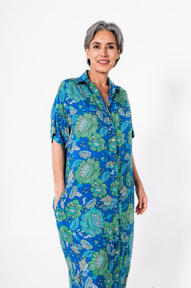 Front view of floral multicolor green blue Tess Button Front Maxi Tunic Dress maxi silhouette resort