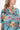 Side view of floral multicolor Tess Button Front Maxi Tunic Dress fluid drape relaxed fit coastal