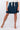 Close-up of silky-soft knit on navy Taylor Skater Knit Skirt smooth texture skater finish
