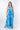 Front view of blue tie-dye Margot V-Neck Empire Waist Maxi Knit Dress maxi silhouette defined waist resort