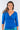 Close-up of silky-soft knit on blue Janice 46115 Sleeve V-Neck Wrap Knit Top wrap detail draped finish