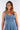 Close-up of silky-soft knit on blue Jen V-Neck Empire Waist Knit Dress empire waist draped finish