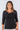 Close-up of silky-soft knit on black Aly 46115 Sleeve Lattice Neck Knit Top hand-cut lattice detail