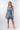 Front view of blue multicolor print Amy Above-Knee V-Neck Empire Waist Knit Dress A-line defined waist beachside