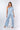 Front view of multicolor light blue white Gigi Asymmetrical One-Shoulder Knit Jumpsuit one-shoulder silhouette resort