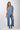 Front view of blue Gigi Asymmetrical One-Shoulder Knit Jumpsuit one-shoulder silhouette relaxed fit resort