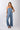 Side view of blue Gigi Asymmetrical One-Shoulder Knit Jumpsuit one-shoulder silhouette fluid drape coastal