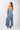 Close-up of blue Gigi Asymmetrical One-Shoulder Knit Jumpsuit silky-soft knit smooth texture finish