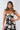 Close-up of silky-soft knit on floral black white Beth Sweetheart Midi Knit Dress sweetheart neckline detail