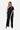 Front view of navy white Lee Asymmetrical One-Shoulder Knit Jumpsuit one-shoulder silhouette resort