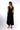 Second view of black Christina V-Neck Wide-Leg Knit Jumpsuit one-piece silhouette easy wear coastal