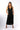 Front view of black Christina V-Neck Wide-Leg Knit Jumpsuit wide-leg silhouette relaxed fit resort