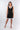 Front view of black Juno Above-Knee U-Neck Knit Dress sheath silhouette contrast trim resort