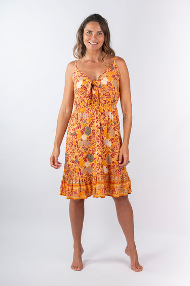 Front view of floral yellow gold Olivia Tie-Front Ruffle Dress relaxed silhouette easy fit resort