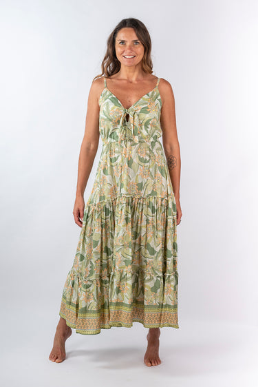Front view of floral soft blue Sandra Tie-Front Ruffle Maxi Dress maxi silhouette relaxed fit resort