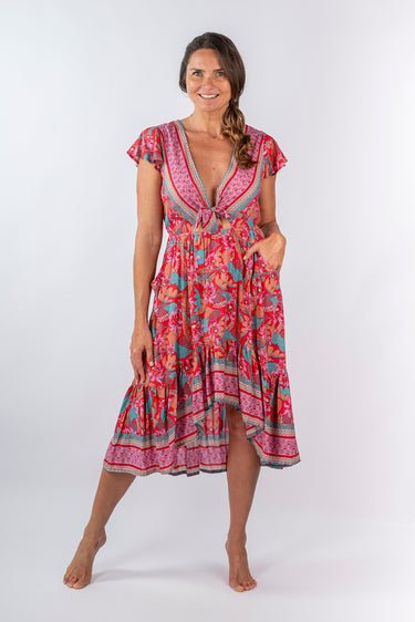 Front view of floral purple pink Sophie Tie-Front High Low Dress With Flutter Sleeves relaxed silhouette resort