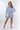 Front view of white geometric blue Juliette Romper With Drawstring Waist one-piece silhouette relaxed fit resort