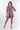 Front view of floral pink Juliette Romper With Drawstring Waist one-piece silhouette relaxed fit resort