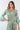 Close-up of super-soft rayon on floral mint Mila V-Neck Ruffle Dress print placement varies