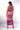 Back view of multicolor tie-dye red blue Kate Reversible Lattice Back Midi Dress lattice back styling resort