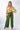 Front view of olive green Camilla Flowy Mock Wrap Pants relaxed wide-leg silhouette easy fit resort