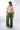 Back view of olive green Camilla Flowy Mock Wrap Pants fluid drape relaxed fit coastal