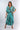 Front view of brown tie-dye blue green Sara Ankle-Length Mock Wrap Pants relaxed wide-leg silhouette resort