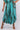 Close-up of super-soft rayon on brown tie-dye blue green Sara Ankle-Length Mock Wrap Pants artisanal finish