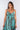 Close-up of super-soft rayon on brown tie-dye blue green Diana High-Low Midi Ruffle Dress artisanal tie-dye finish