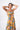 Side view of floral multicolor yellow Laura Empire Waist Maxi Dress With Slits fluid drape coastal
