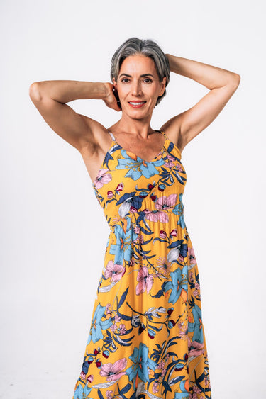 Side view of floral multicolor yellow Laura Empire Waist Maxi Dress With Slits fluid drape coastal