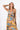 Side view of floral multicolor yellow Kate Reversible Lattice Back Midi Dress fluid drape relaxed fit coastal