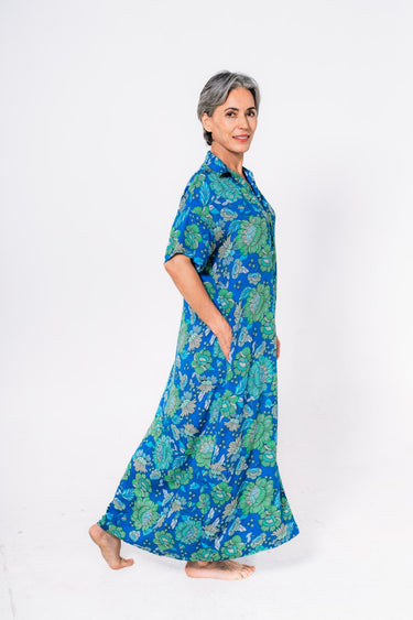 Side view of floral multicolor green blue Tess Button Front Maxi Tunic Dress fluid drape coastal