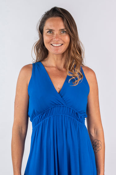 Close-up of silky-soft knit on blue Amy Above-Knee V-Neck Empire Waist Knit Dress soft gathers draped finish