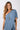 Back view of blue Gigi Asymmetrical One-Shoulder Knit Jumpsuit one-shoulder silhouette relaxed fit resort
