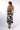 Back view of floral black white Beth Sweetheart Midi Knit Dress adjustable straps fluid drape resort