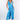 Front view of blue tie-dye Christina V-Neck Wide-Leg Knit Jumpsuit wide-leg silhouette relaxed fit resort
