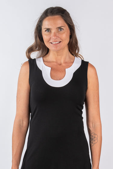 Close-up of silky-soft knit on black Juno Above-Knee U-Neck Knit Dress contrast neckline detail finish