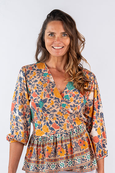 Close-up of super-soft rayon on floral multicolor Kiera 46115 Sleeve Ruffle Wrap Top print placement varies