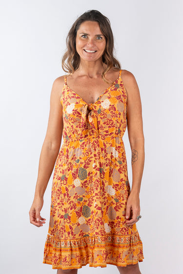 Close-up of super-soft rayon on floral yellow gold Olivia Tie-Front Ruffle Dress print placement varies