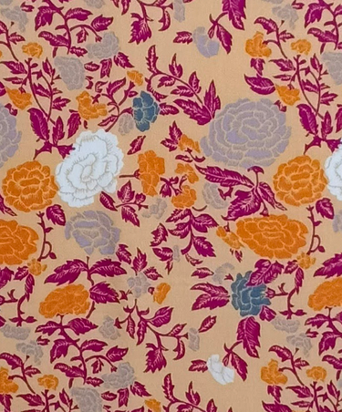 Detail of floral yellow gold Olivia Tie-Front Ruffle Dress super-soft rayon tie-front finish