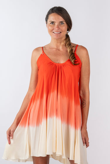 Close-up of super-soft rayon on dip-dye red orange Stella Above-Knee Swing Dress artisanal dip-dye finish
